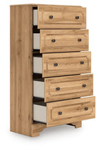 Warm brown five-drawer chest with carved drawer fronts and dark metal knobs