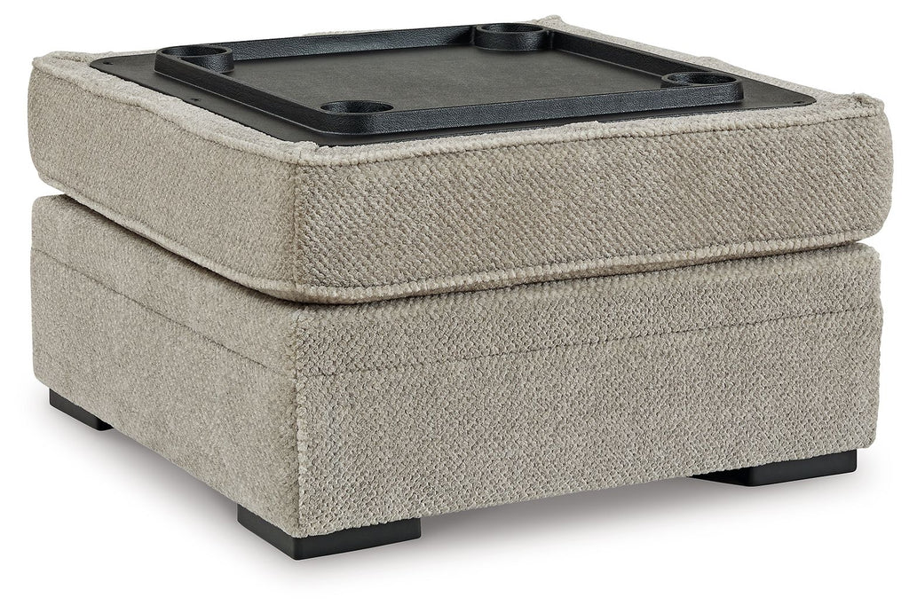 Light beige storage ottoman with open lid showing a black tray
