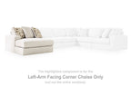 Left-facing corner chaise section in light beige fabric with patterned pillows