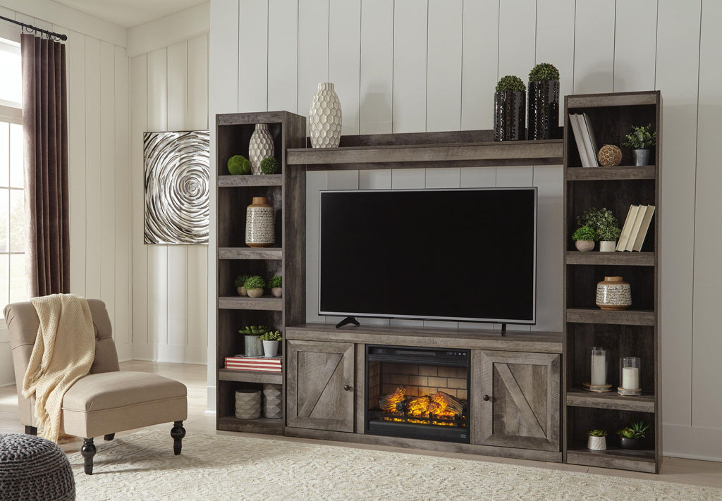 Gray media console with large TV opening, lower faux firebox, and paneled cabinet doors