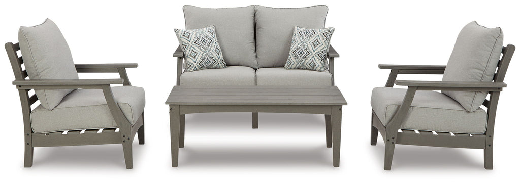 Outdoor lounge set in gray: sofa, two armchairs, and rectangular coffee table