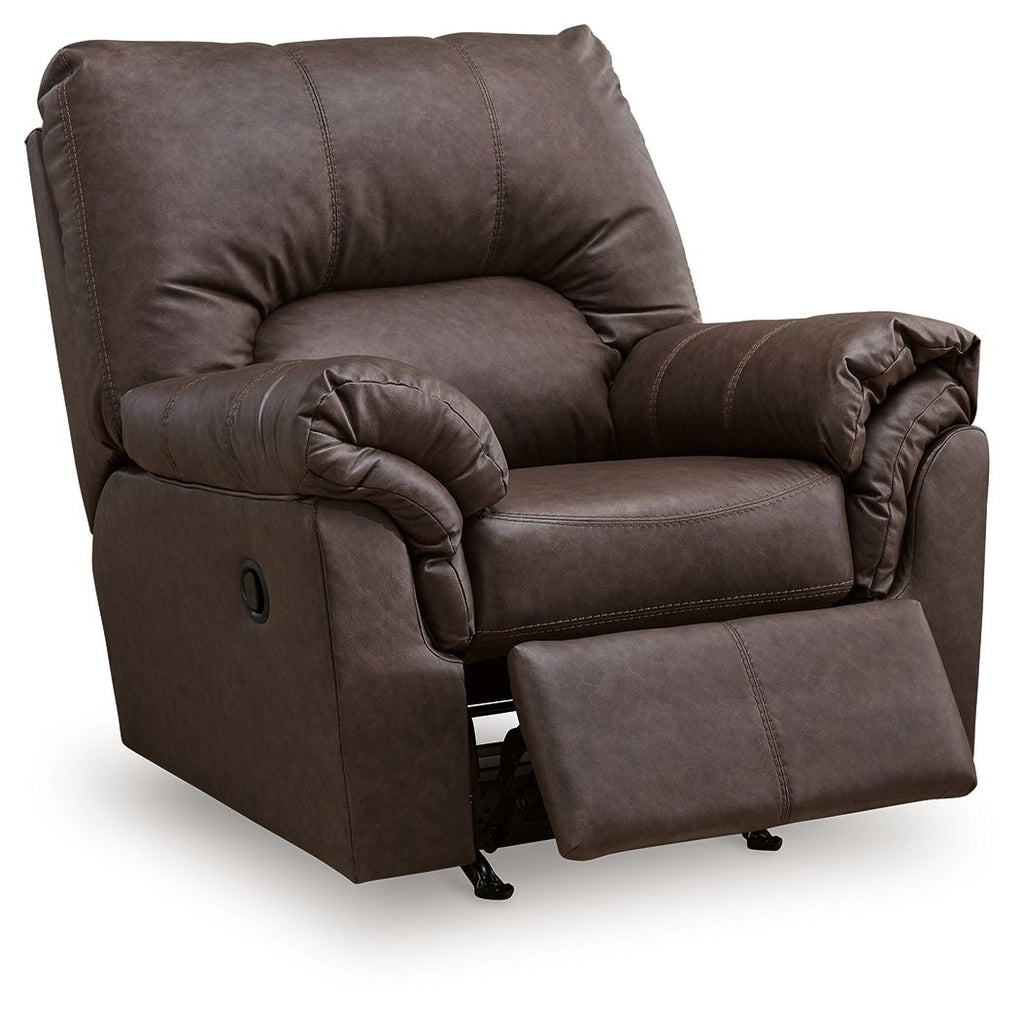 Dark umber upholstered rocker recliner with ottoman extended and tufted backrest