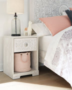 Paxberry whitewash night stand with cubby basket and carved drawer front