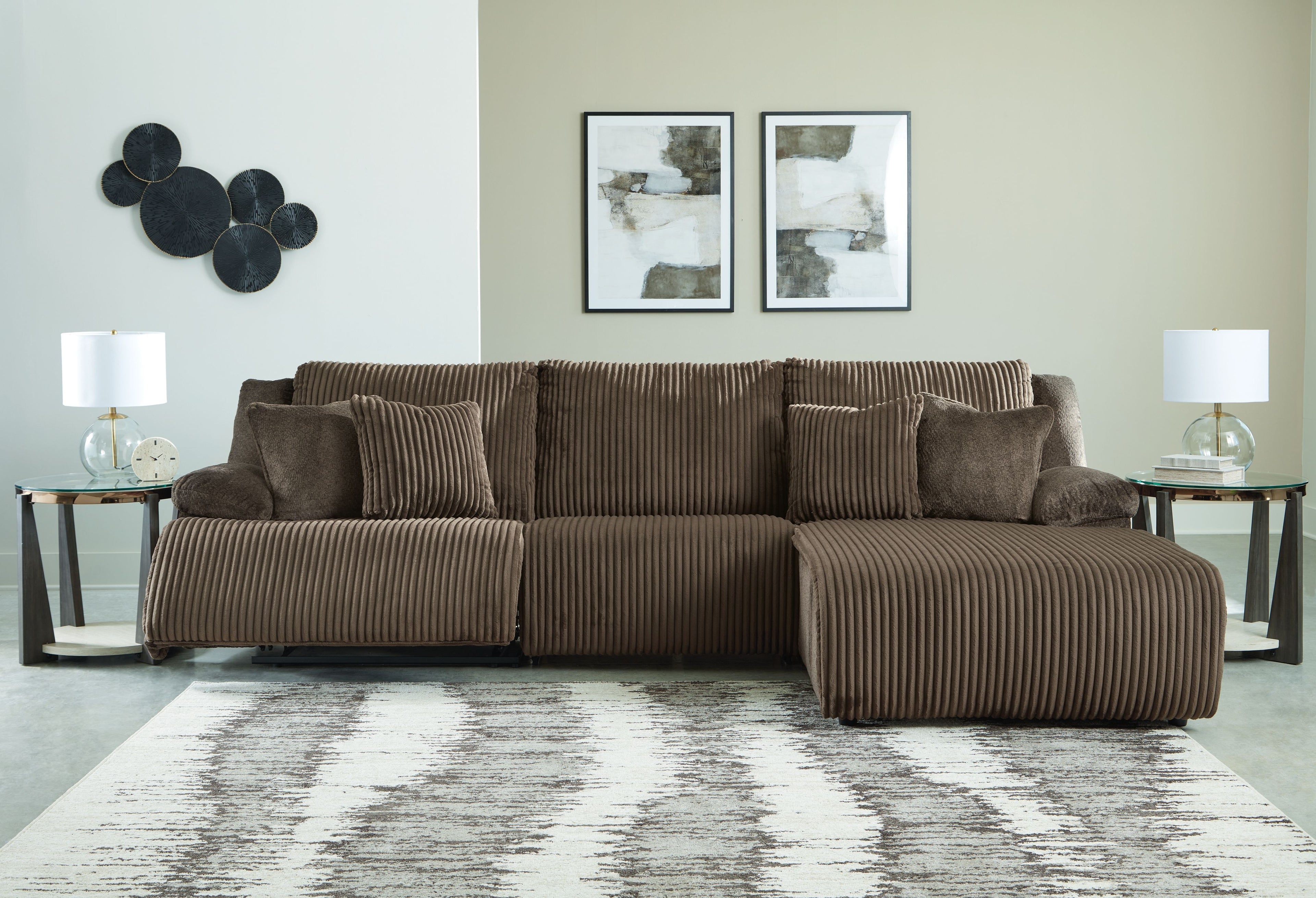 Brown striped reclining sectional sofa with chaise-style reclining seat