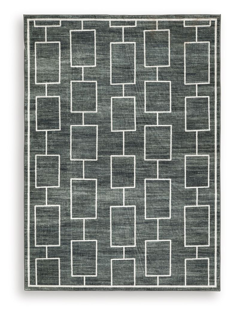 Elderland washable rug with dark charcoal field and white geometric block pattern