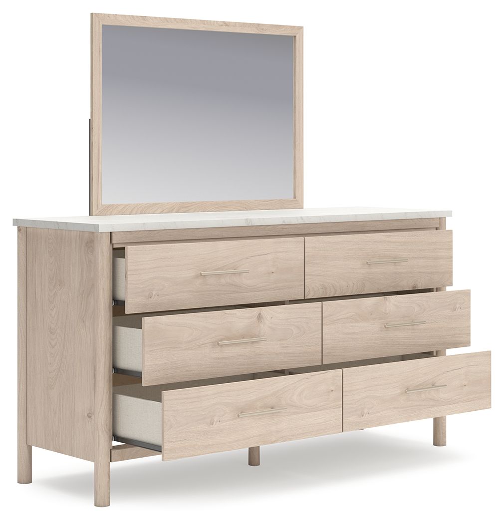 Light beige wood dresser with attached mirror and six drawer fronts