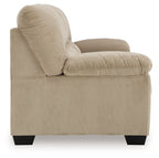 Light beige upholstered recliner chair with padded arms and curved cushion back.