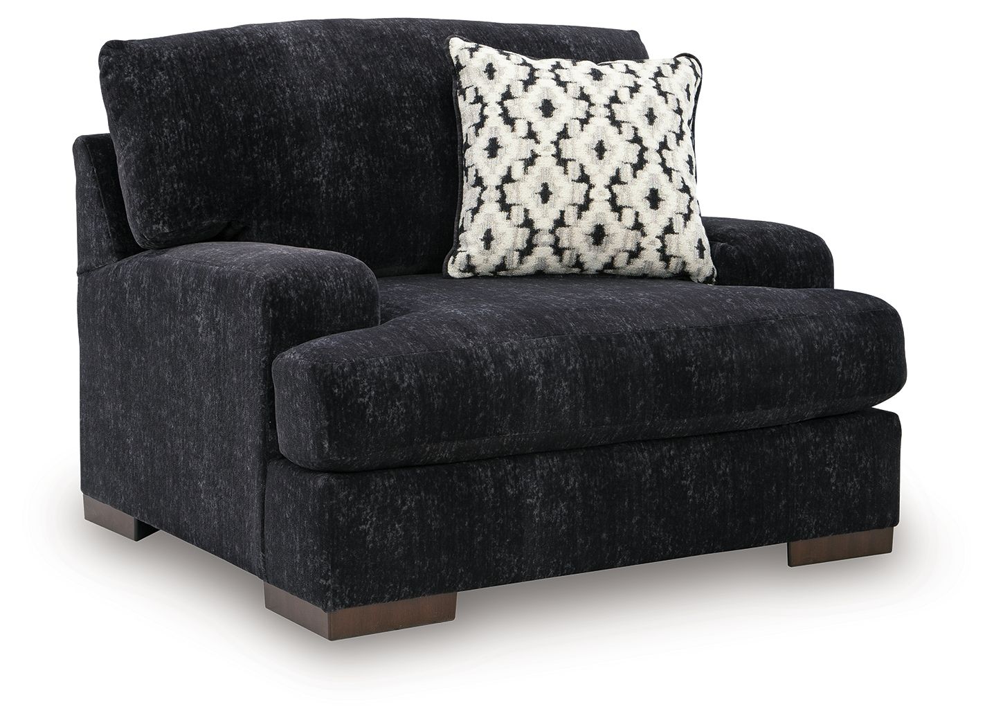 Black chair-and-a-half with rounded arms, thick seat, and patterned accent pillow