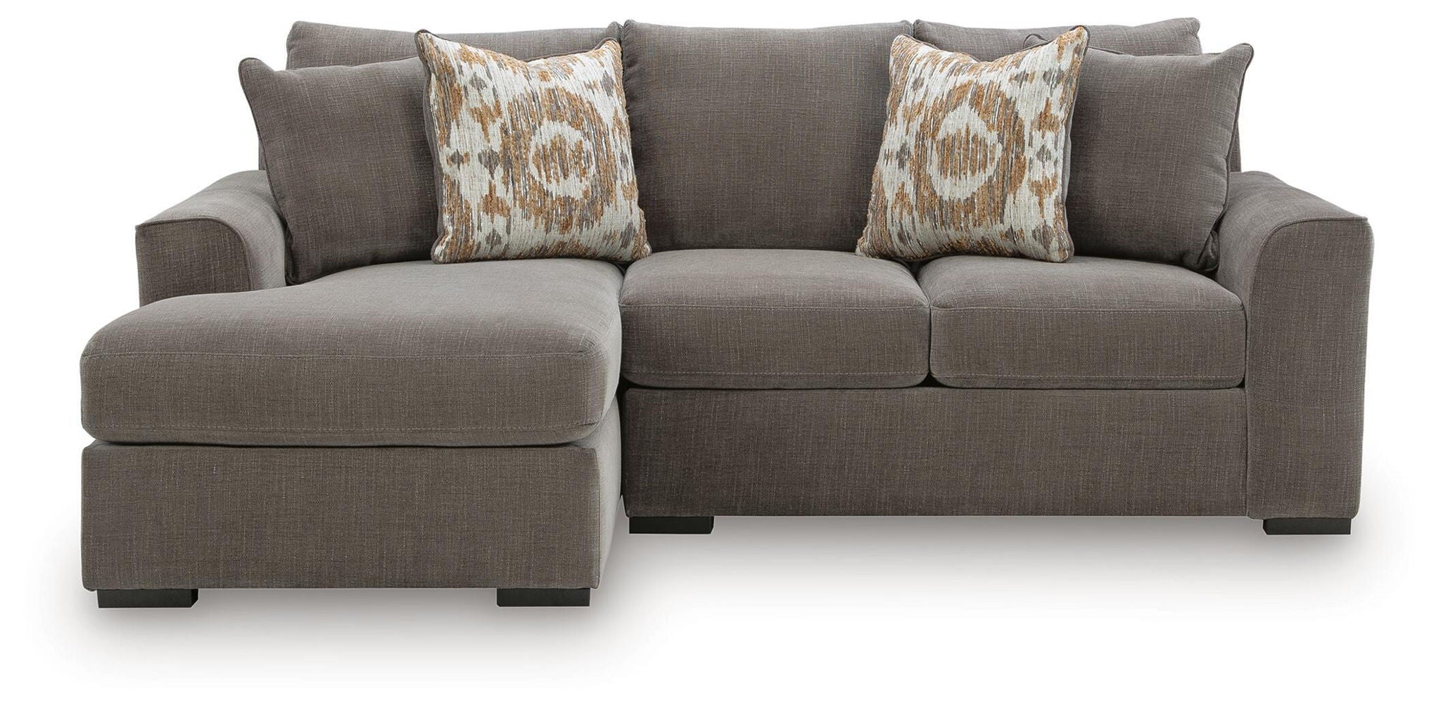 Gray sectional sofa with chaise on left side and two patterned throw pillows