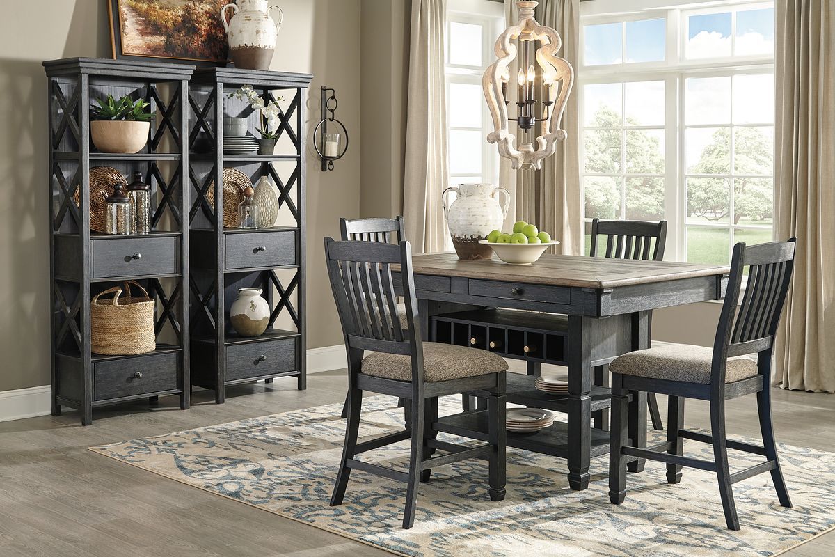 Dark gray counter height dining table with bar stools and display shelving cabinet