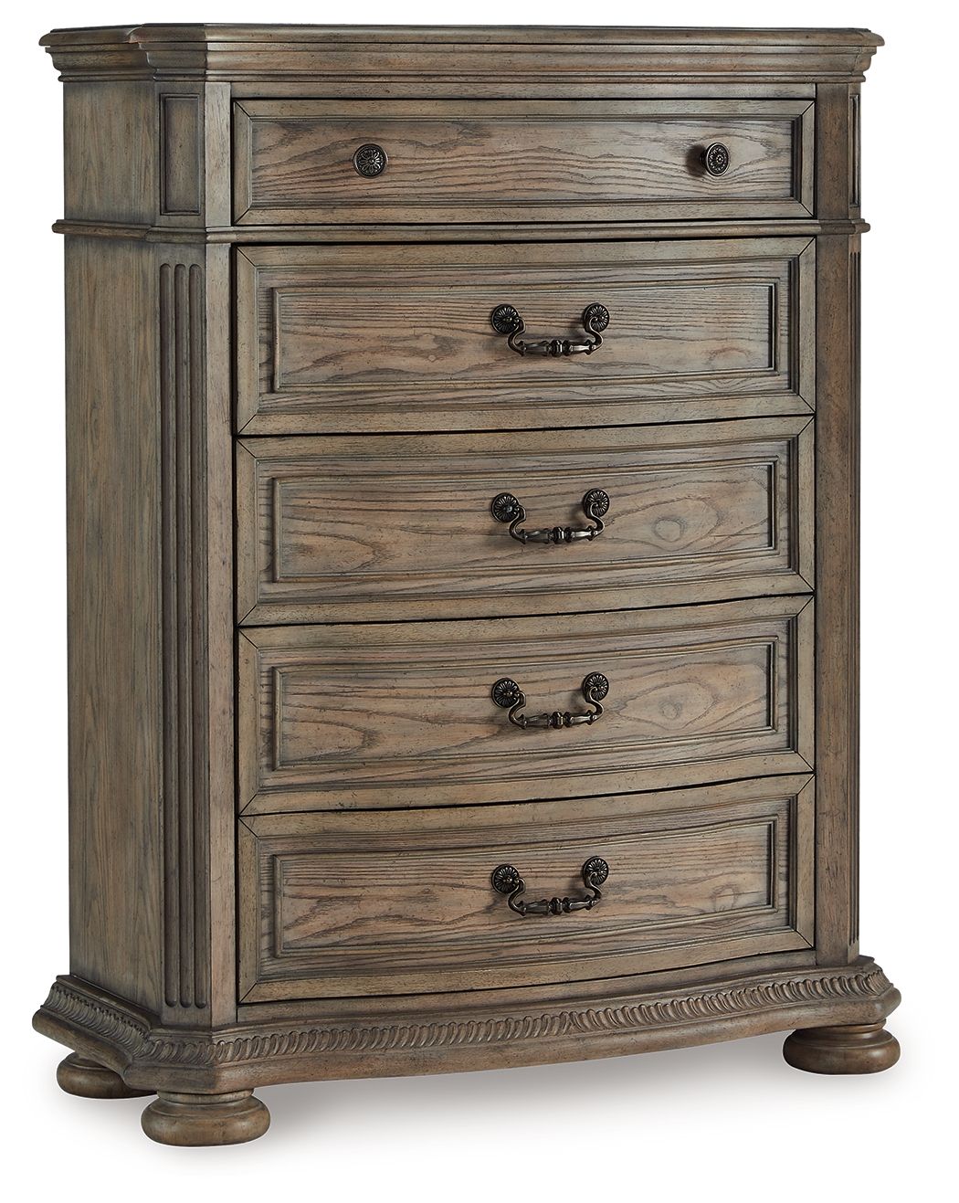 Light brown five-drawer chest with black metal knobs and carved drawer fronts