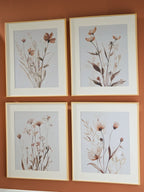 Set of 4 framed botanical wall prints with beige frames and blush-gray flowers