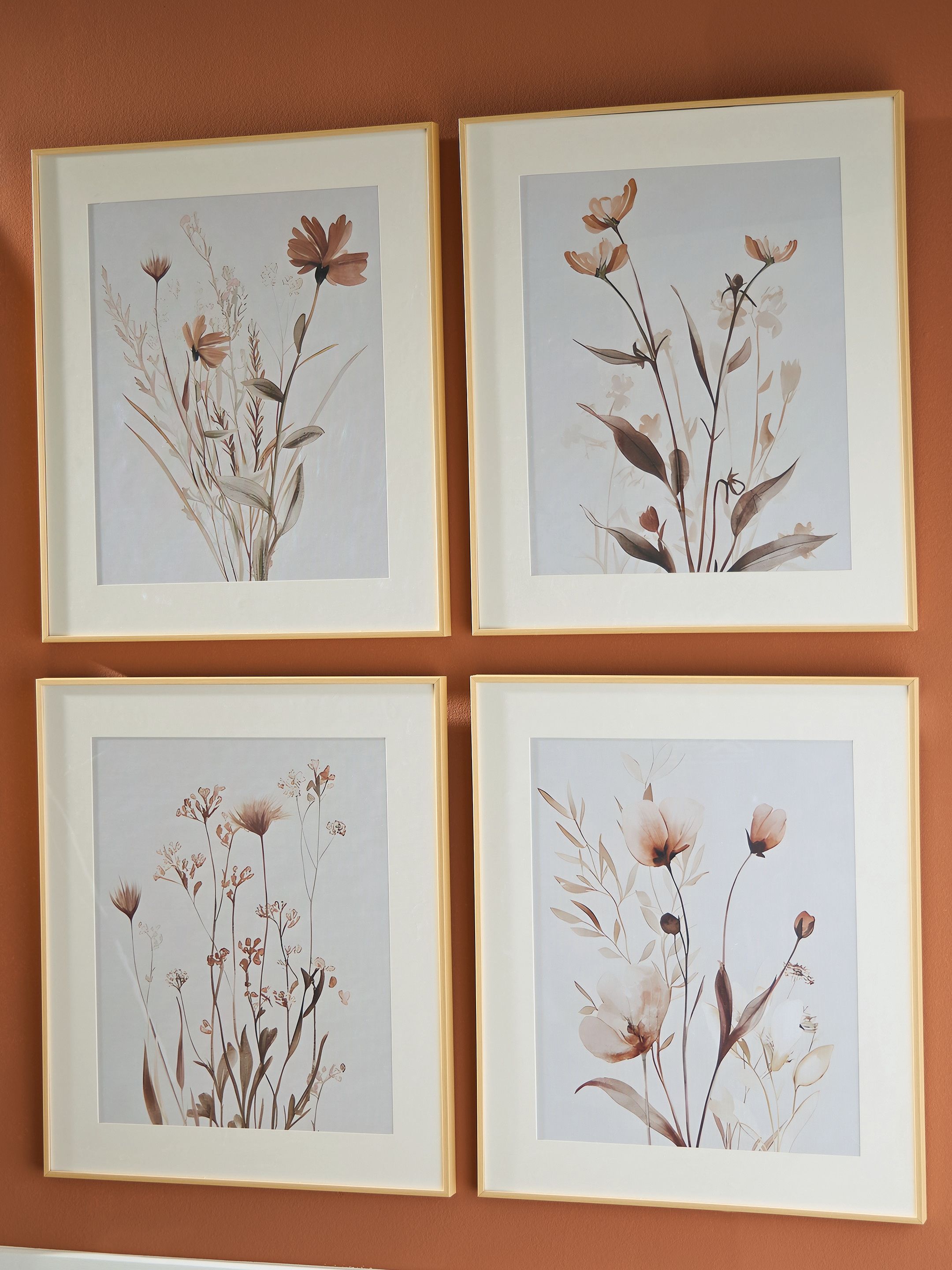 Set of 4 framed botanical wall prints with beige frames and blush-gray flowers