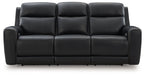 Power reclining sofa with adjustable headrests, black upholstery, tufted seat cushions