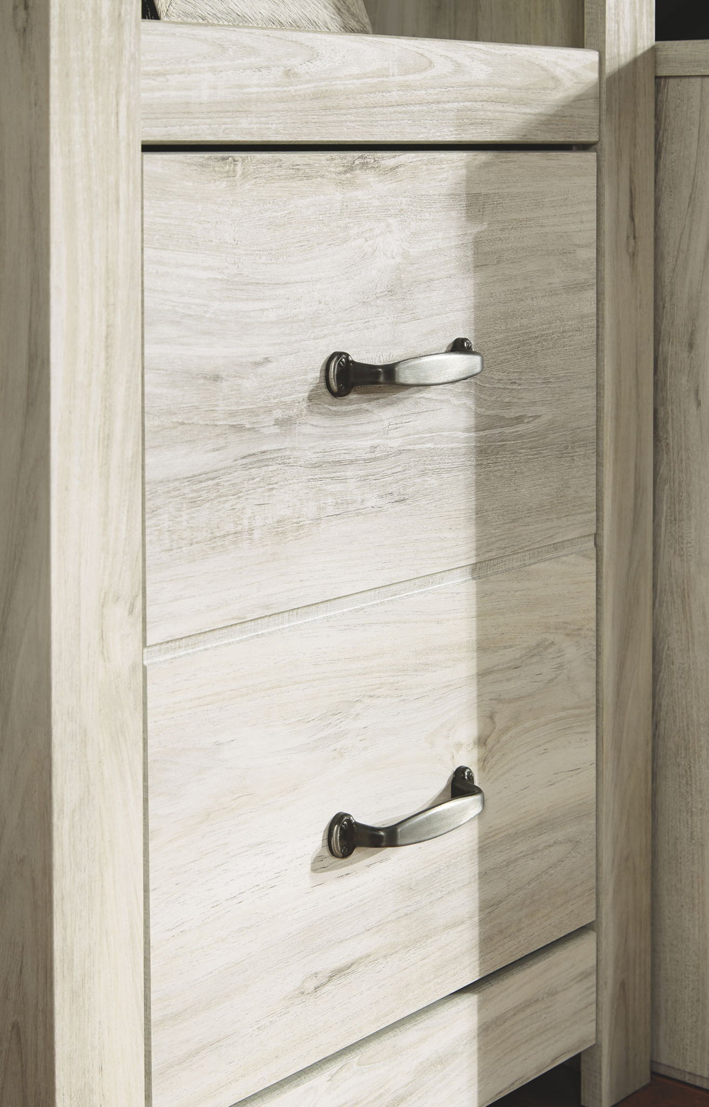 Whitewash cabinet with two stacked drawer fronts and knob pulls