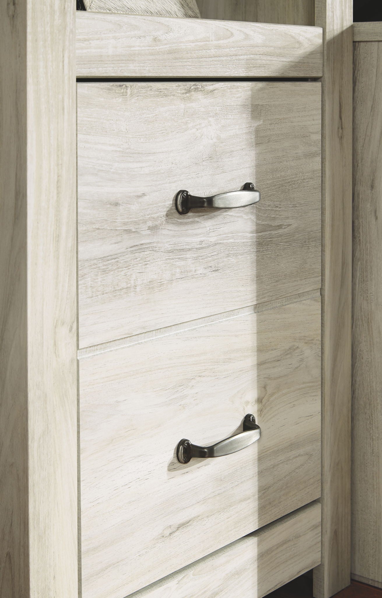 Whitewash cabinet with two stacked drawer fronts and knob pulls