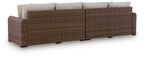 Outdoor loveseat set with brown woven frame and beige back cushions