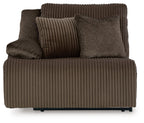 Chocolate wall recliner front view with ribbed seat, padded backrest, and arm cushions