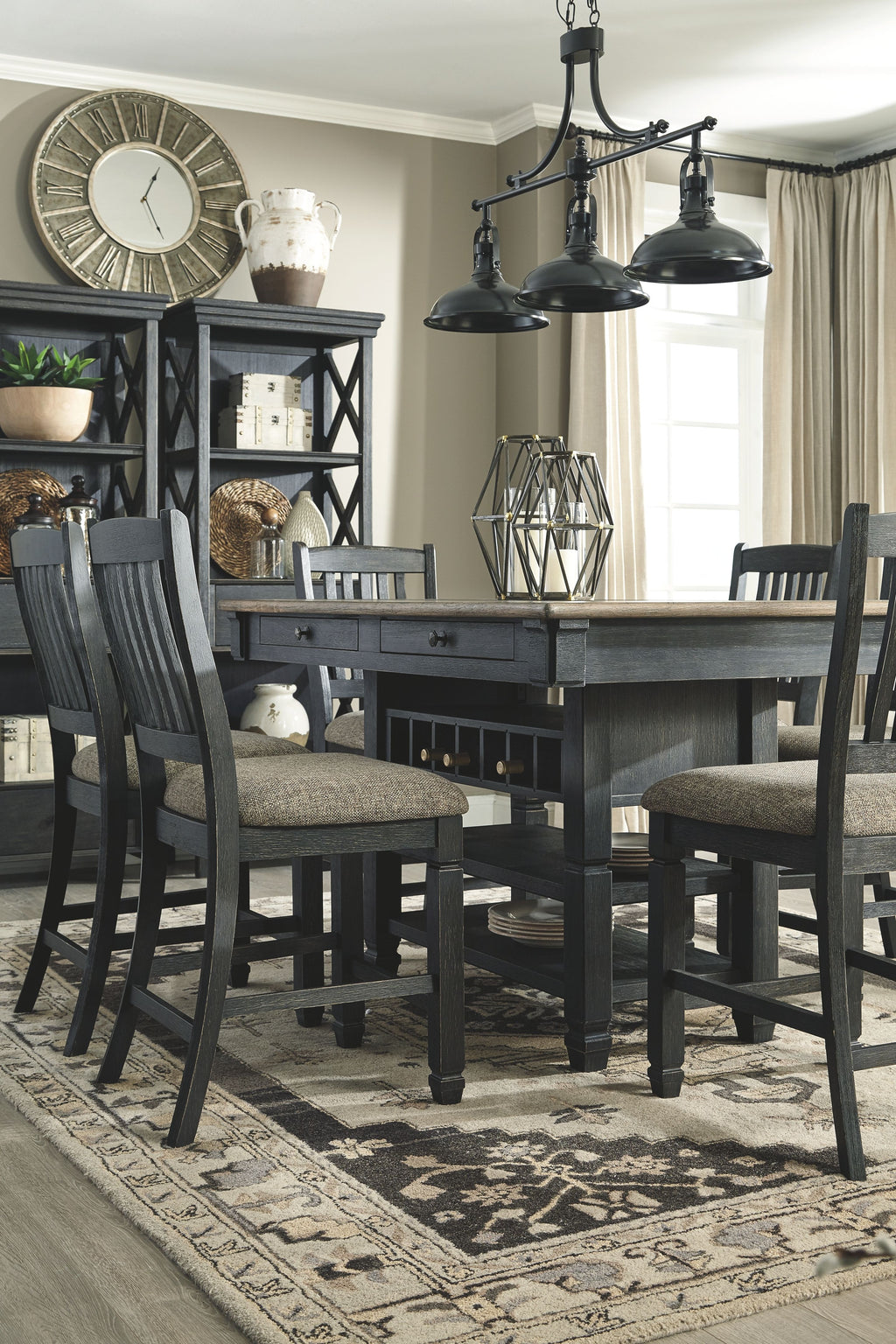 Dark gray counter-height dining table with chairs and matching display cabinets