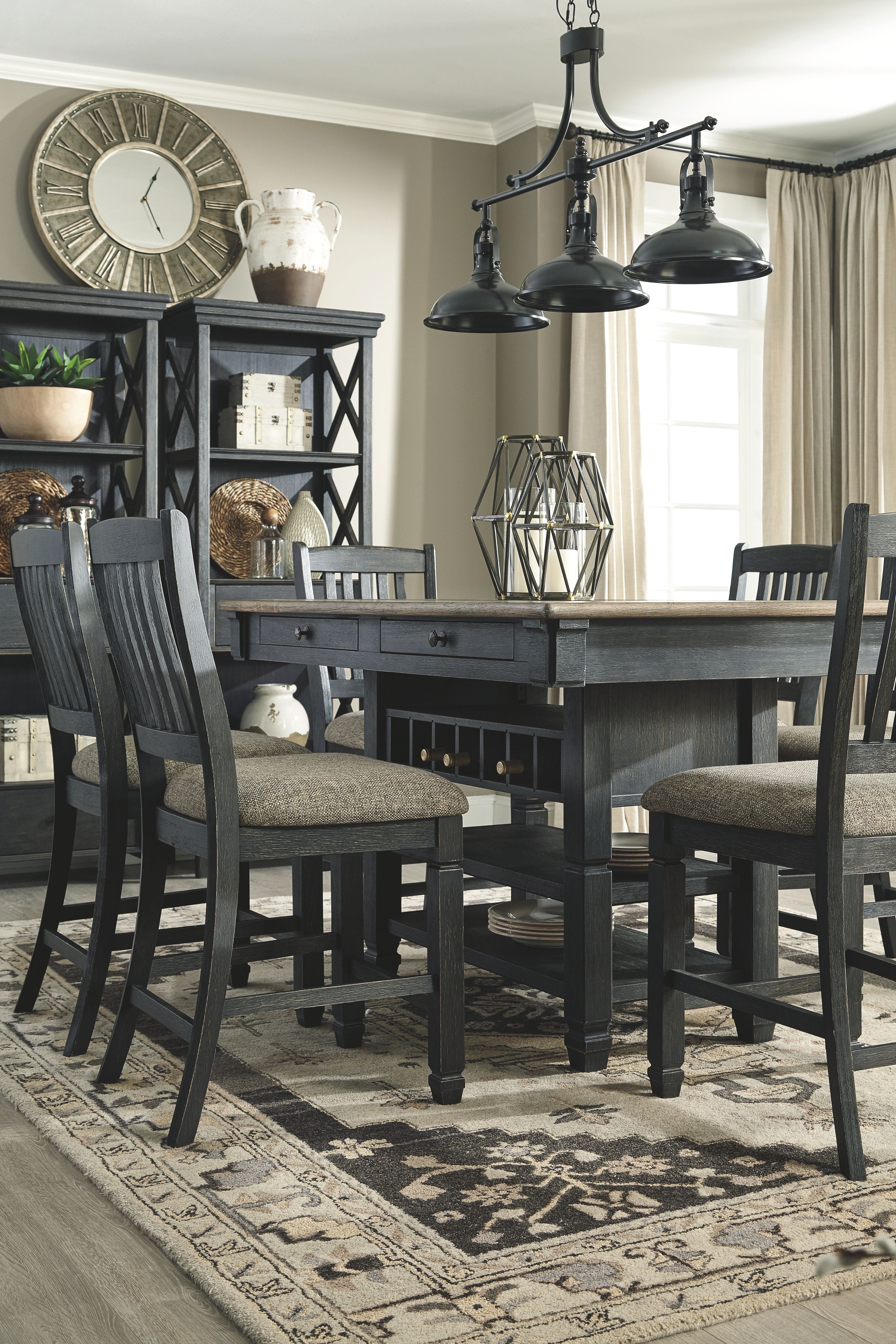 Dark gray counter-height dining table with chairs and matching display cabinets