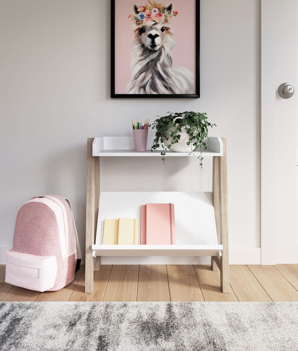 Small white bookcase with two shelves holding upright books, light wood frame