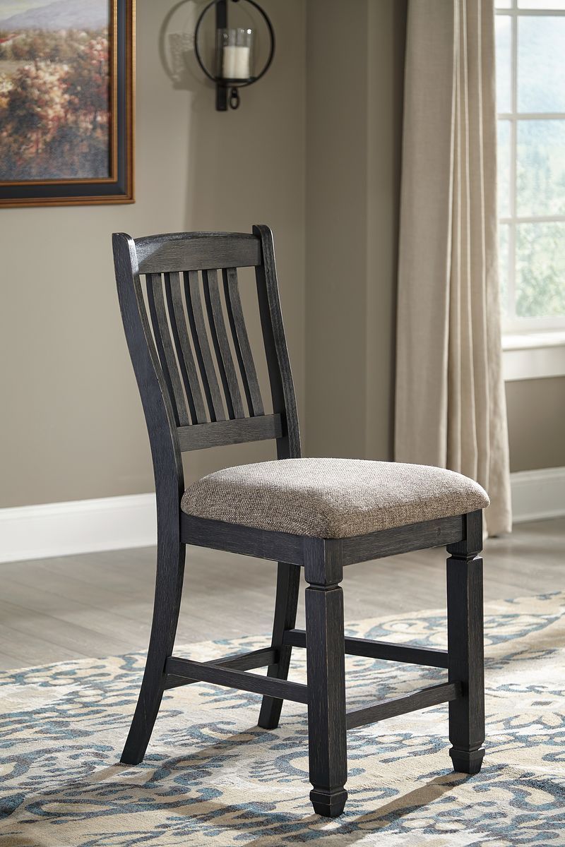 Dark gray upholstered dining chair with slat back and padded seat