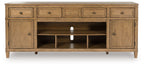 Light brown wooden TV stand with fireplace insert, central open shelves, three drawers