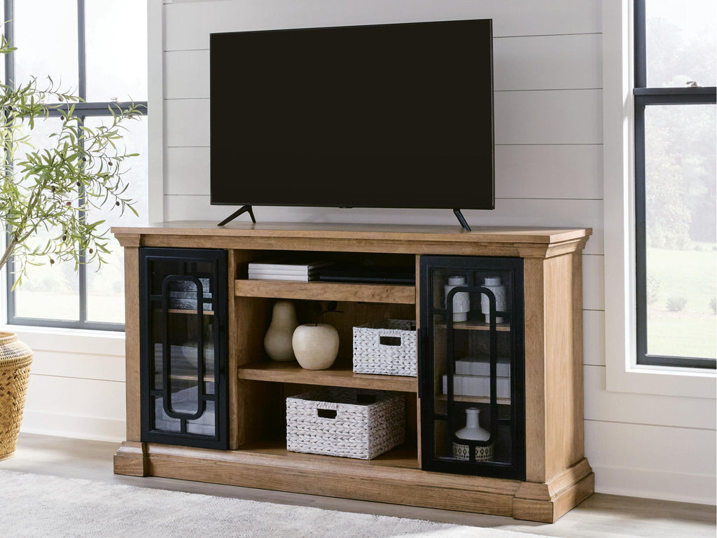 Light brown TV stand with mounted TV, glass doors, and electric fireplace insert with embers.