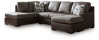 Dark fossil sectional sofa with chaise corner and gray patterned throw pillows