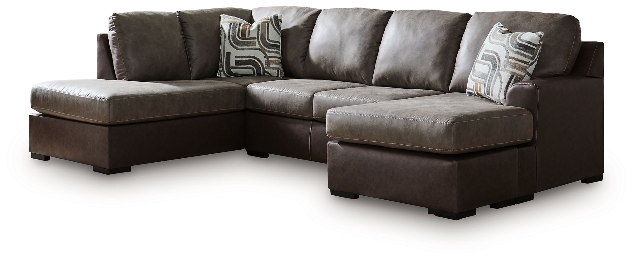 Dark fossil sectional sofa with chaise corner and gray patterned throw pillows