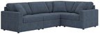 Blue L-shaped sectional sofa with buttonless back cushions and armrests
