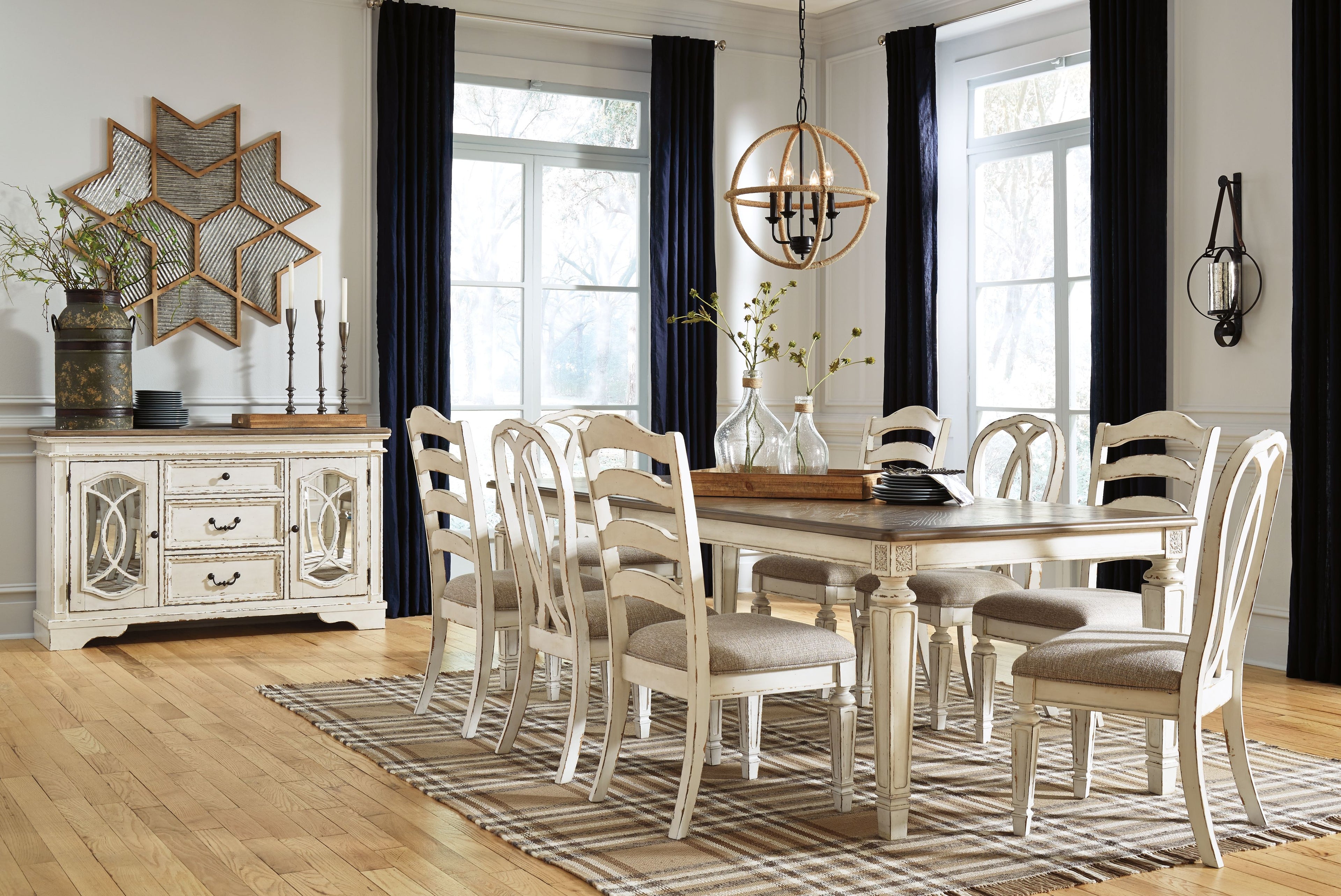 White rectangular dining table with matching spindle-back chairs and server in room