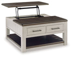 Lift-top cocktail table showing lift mechanism, dark slatted top, two drawers, lower shelf