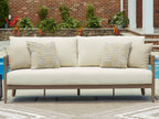Beige sofa with two patterned beige cushions and dark brown wooden legs