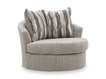 Gray swivel accent chair with rounded seat and patterned throw pillows