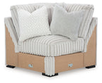 Light gray upholstered sectional wedge with ribbed fabric and boxy armrests