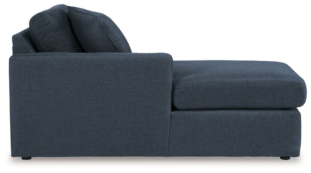 Ink blue corner chaise with tufted-look cushions and rolled back pillows