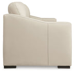 Almond upholstered sofa with tall back cushion and wide arm panel