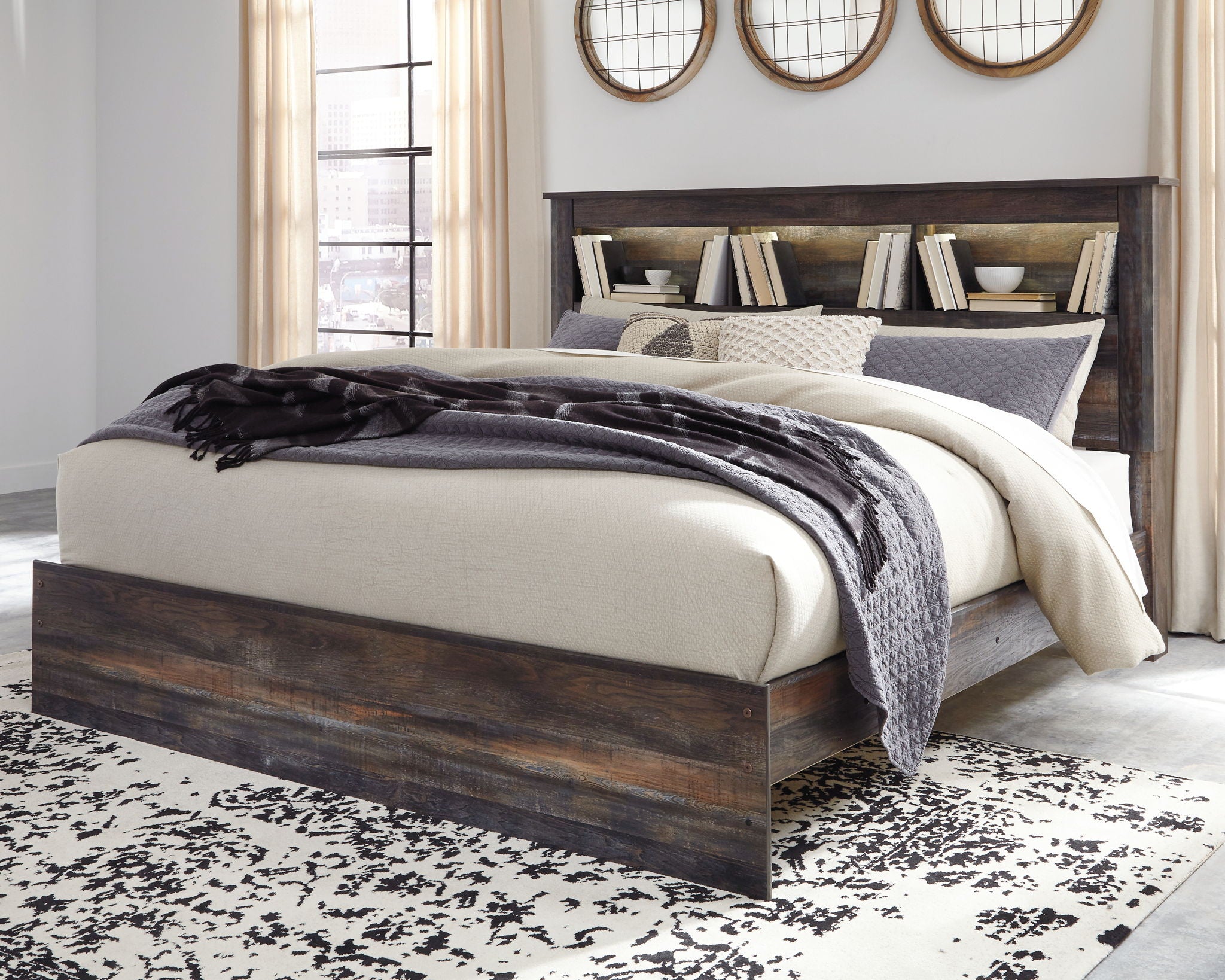 Panel bookcase bed with side storage drawers, dark wood finish, neutral and black bedding