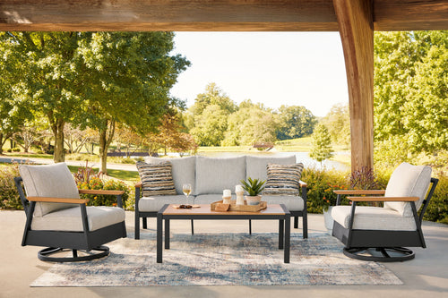 Outdoor sofa and two swivel chairs set with gray cushions and dark coffee table