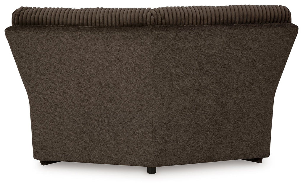 Chocolate brown upholstered wedge sofa section with wide back and tapered base