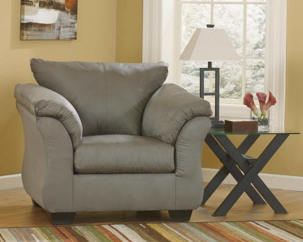 Gray arm chair with rolled back, padded arms, and plush seat cushion