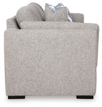 Pewter fabric sofa with patterned throw pillow on the backrest