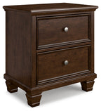 Brown two-drawer nightstand with two front drawers and round metal knobs