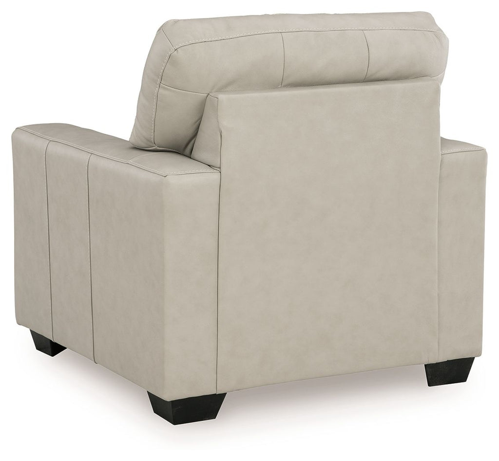 Light beige upholstered accent chair side view with high back cushion