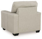 Light beige upholstered accent chair side view with high back cushion
