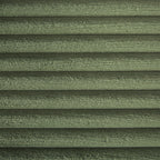 Close-up of green corduroy fabric with horizontal ribbed texture
