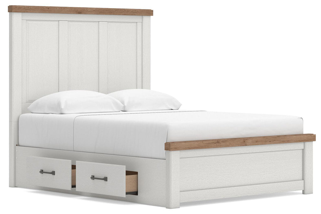 White panel storage bed with wood trim and two pull-out drawer compartments, front angle