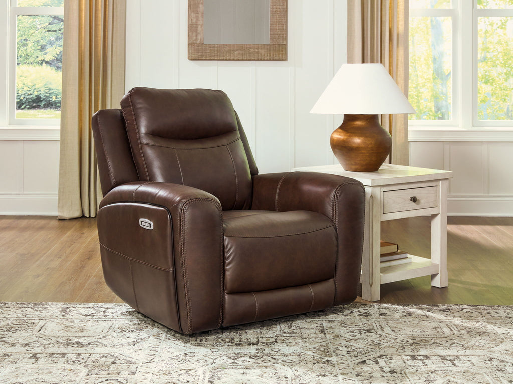 Brown power recliner with adjustable headrest and smooth padded seat
