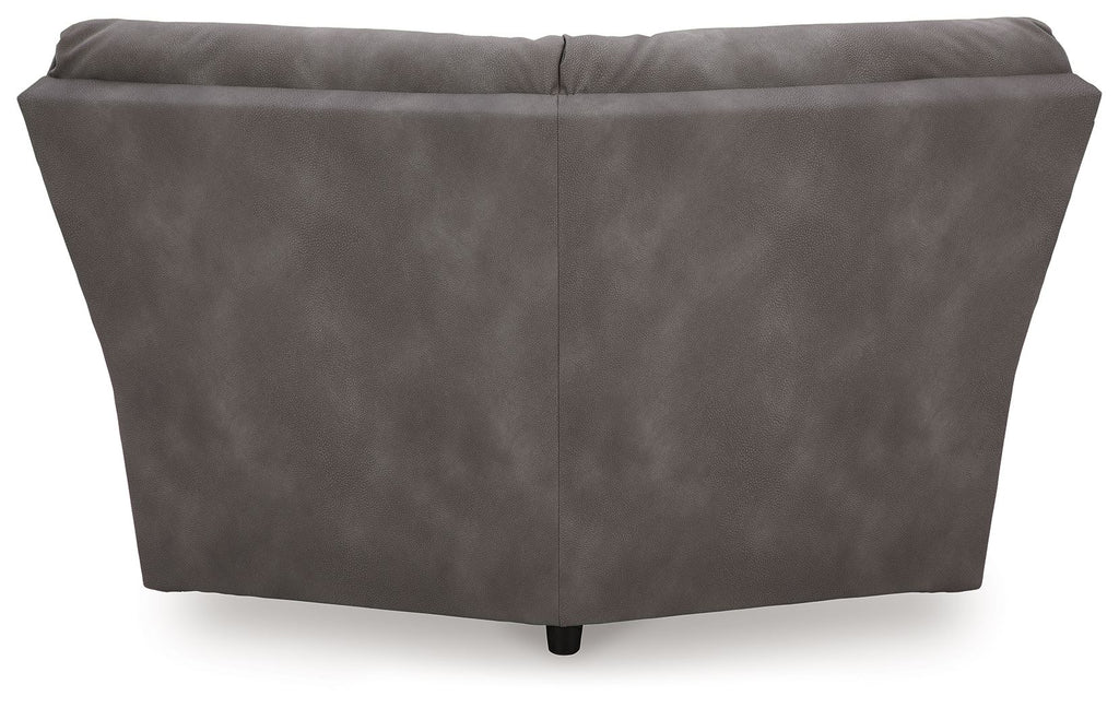 Dark gray upholstered wedge sofa section with smooth back panel and low base